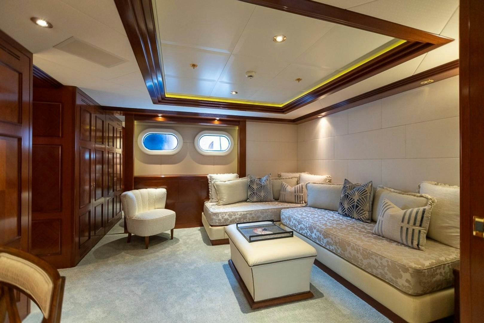 a living room with a large mirror aboard BLUE MOON Yacht for Sale