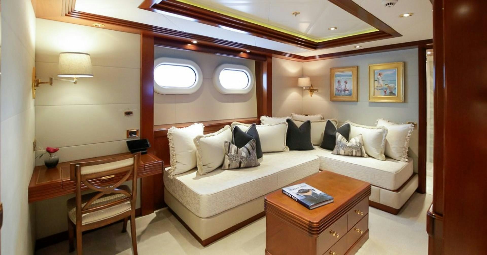 a room with a bed and a desk aboard BLUE MOON Yacht for Sale
