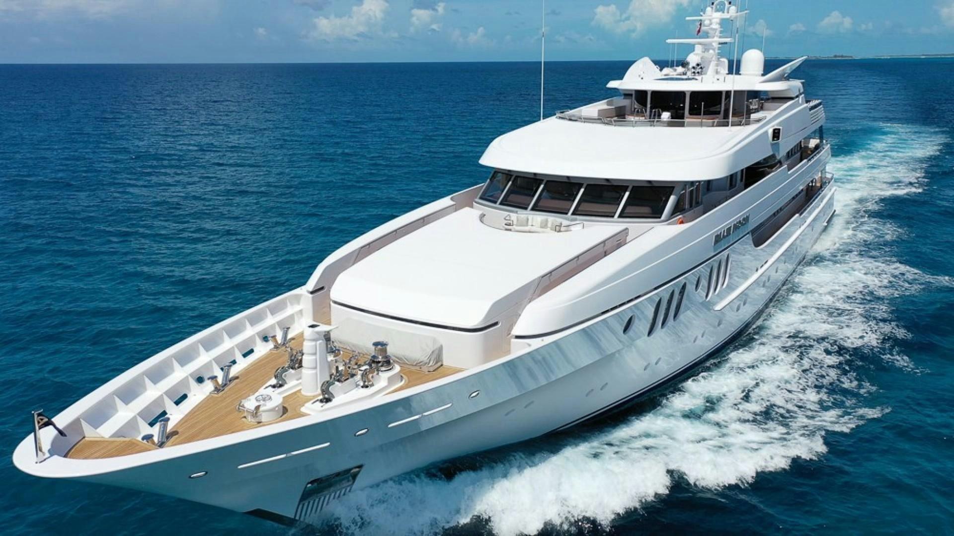 a white yacht in the water aboard BLUE MOON Yacht for Sale