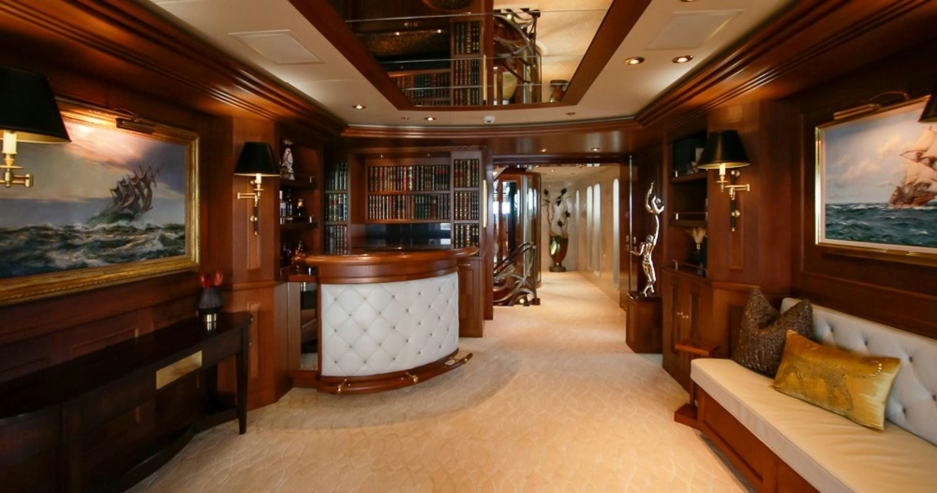 a room with a bed and a desk aboard BLUE MOON Yacht for Sale