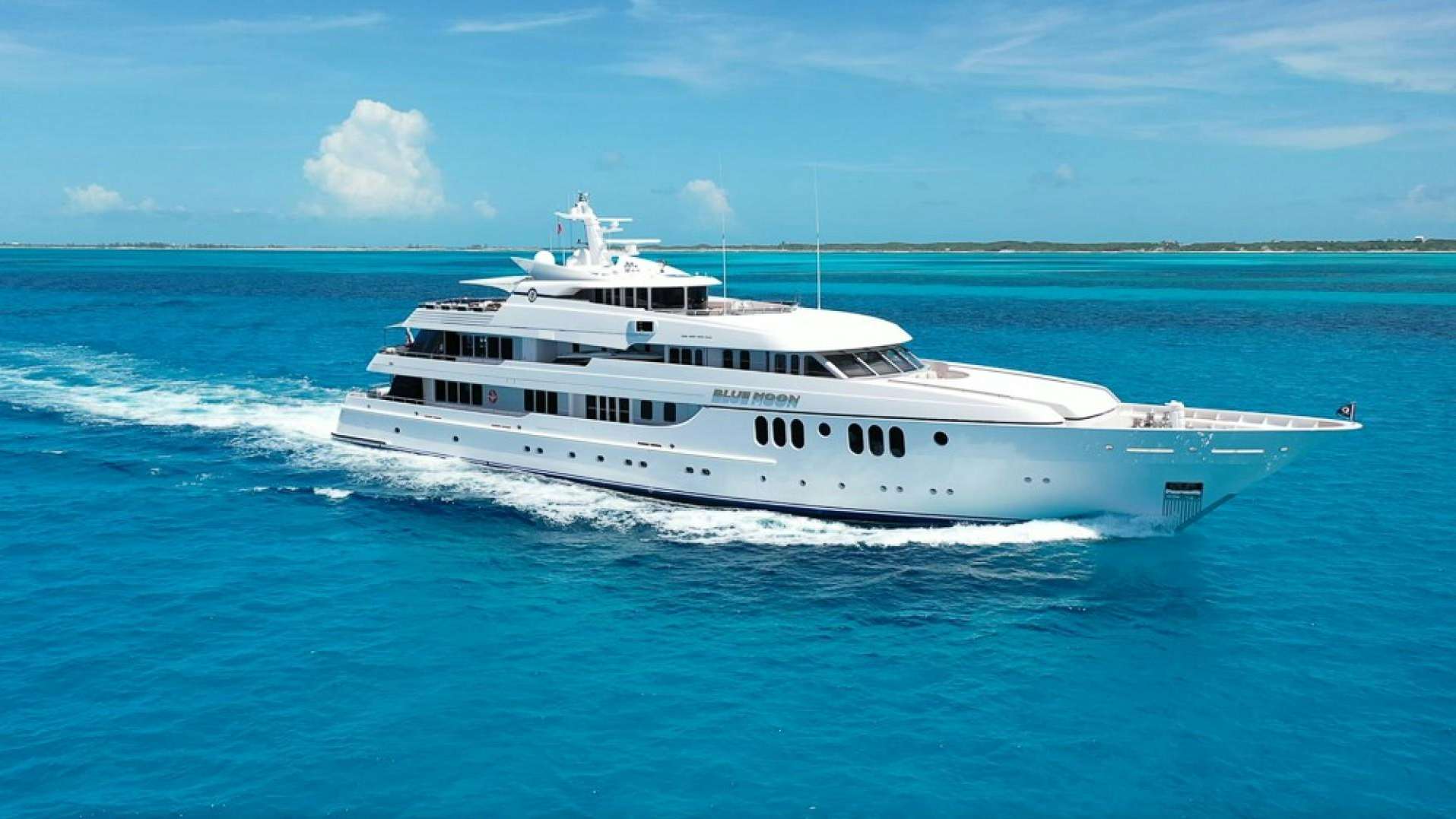 a white yacht in the ocean aboard BLUE MOON Yacht for Sale