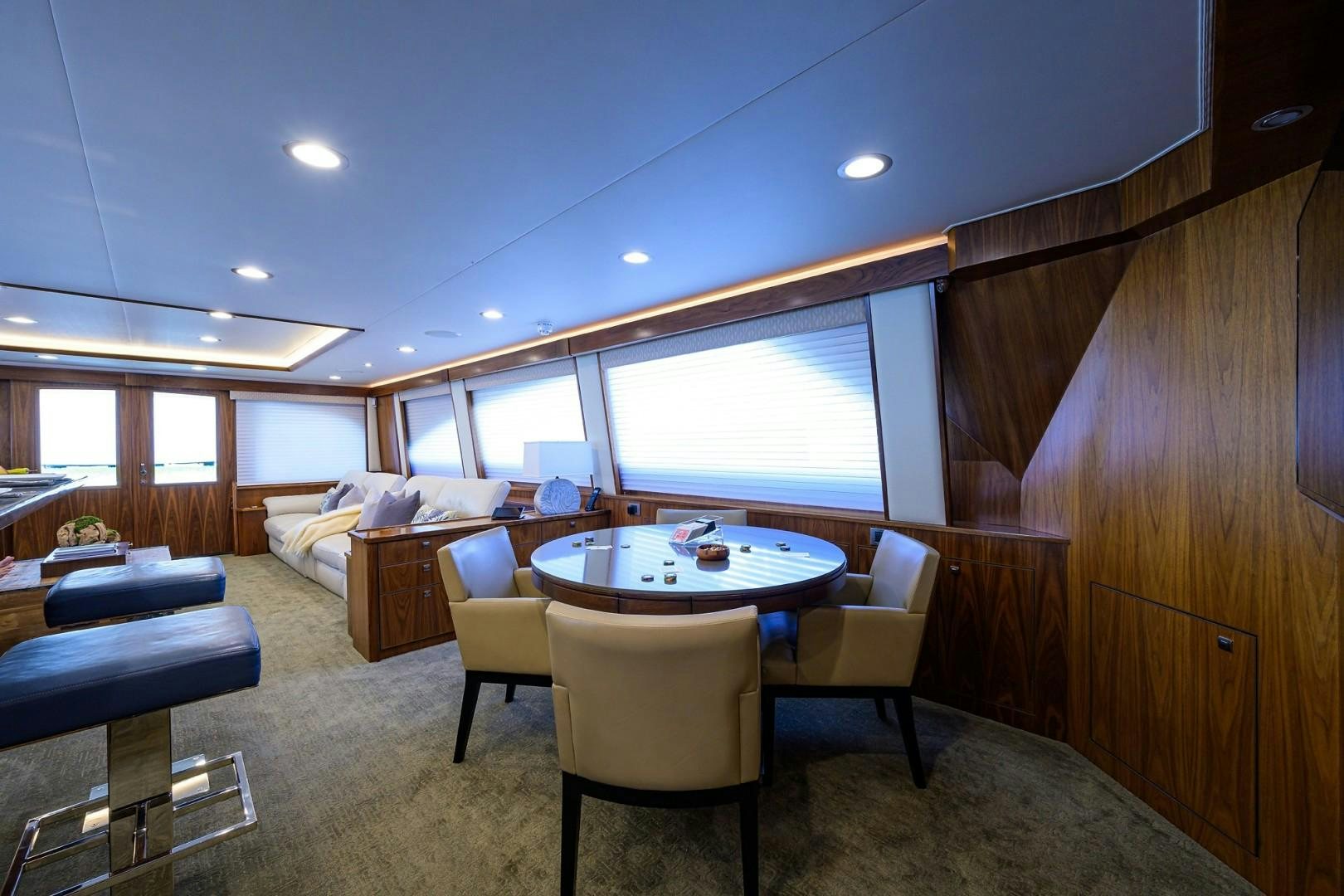 a room with a table and chairs aboard NIKKI BELLA Yacht for Sale