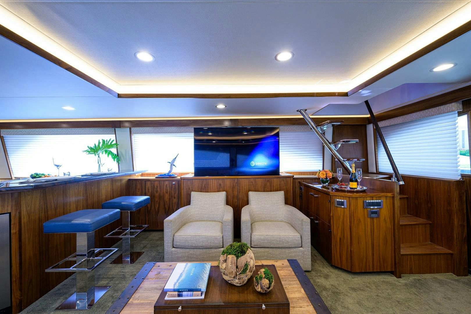 a living room with a couch and a table aboard NIKKI BELLA Yacht for Sale