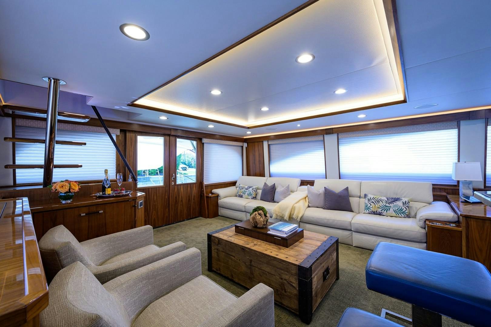 a living room with a large window aboard NIKKI BELLA Yacht for Sale