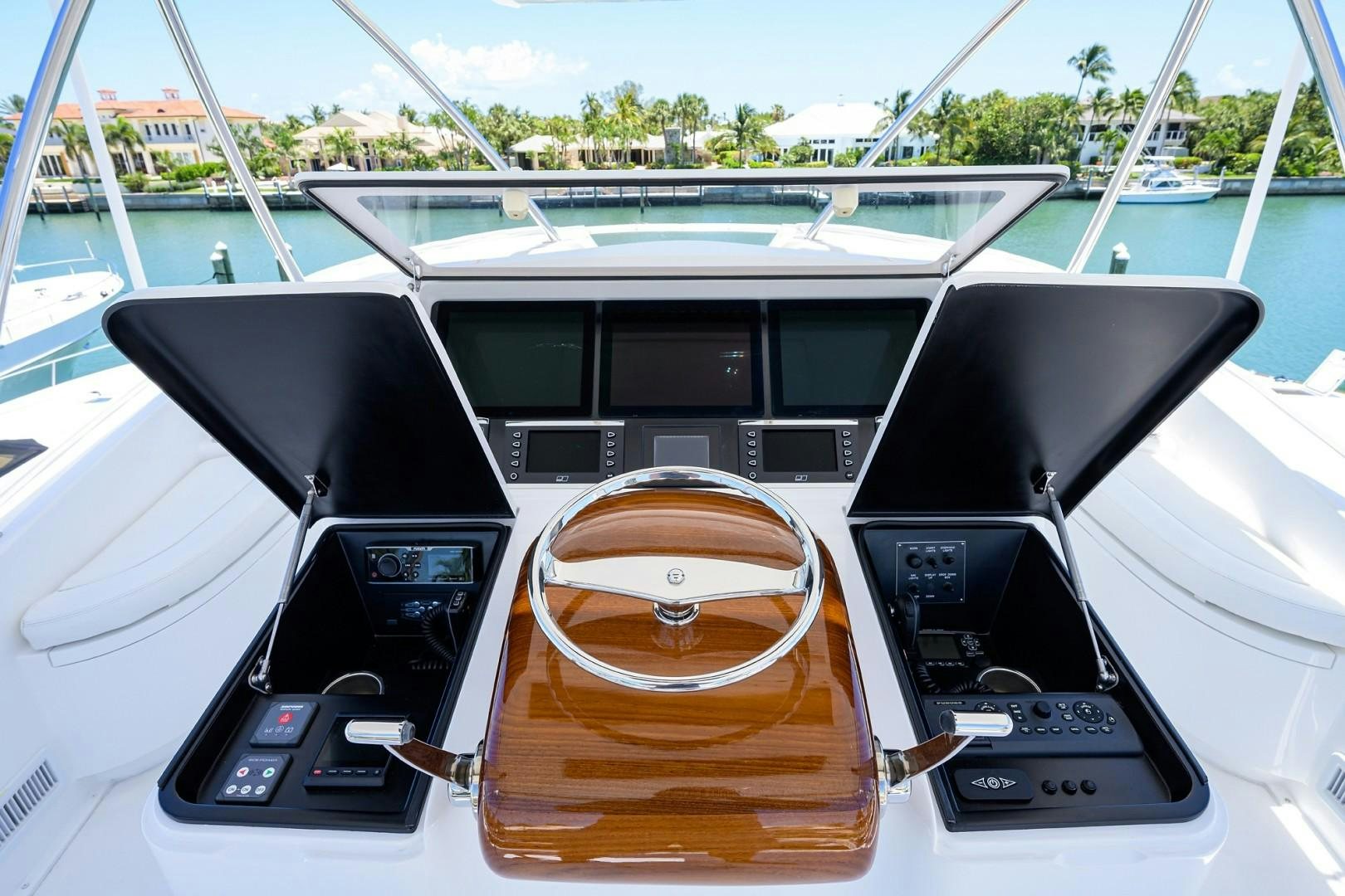 a boat with a steering wheel aboard NIKKI BELLA Yacht for Sale