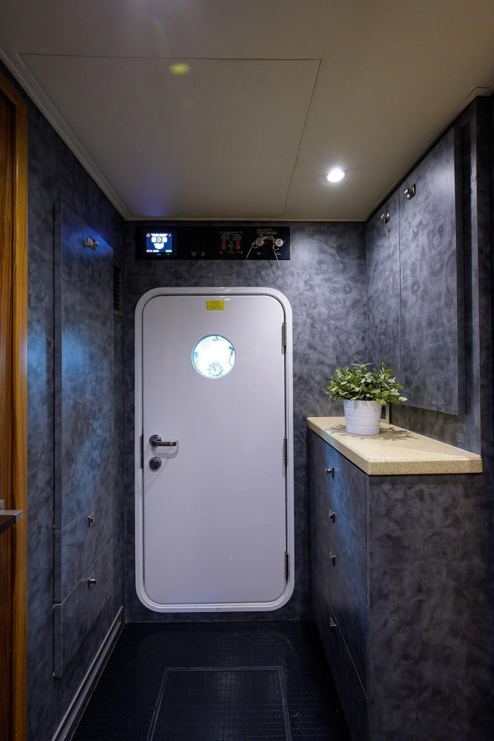 a white door in a room aboard NIKKI BELLA Yacht for Sale