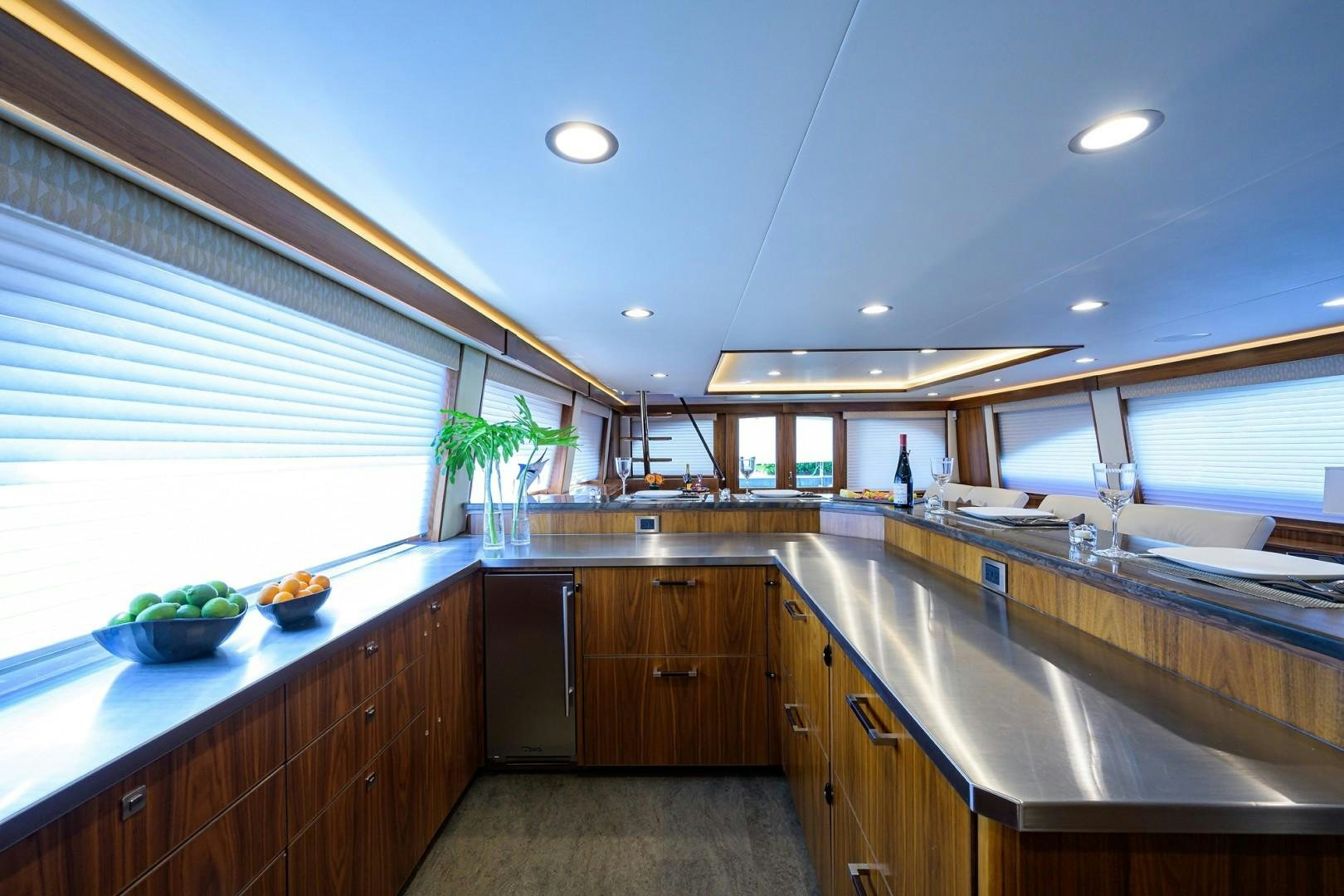 a kitchen with a large island aboard NIKKI BELLA Yacht for Sale