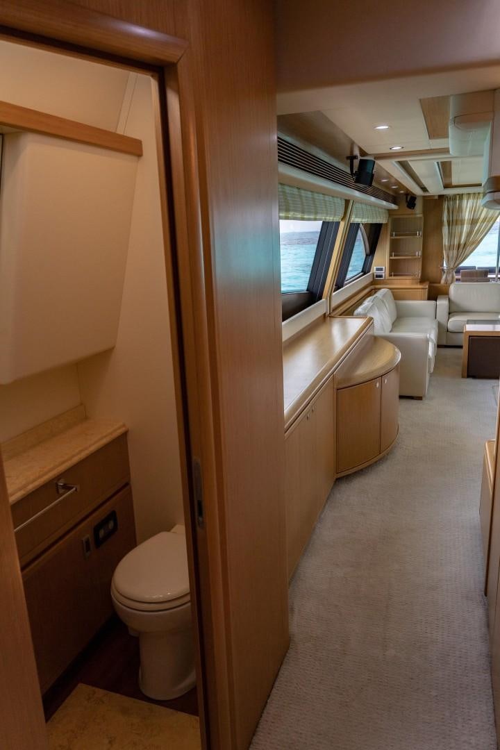 a bathroom with a toilet and a sink aboard FORTIS II Yacht for Sale
