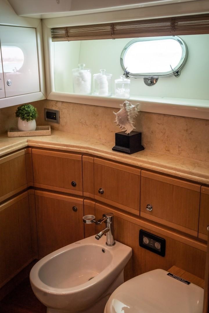 a bathroom with a sink and a mirror aboard FORTIS II Yacht for Sale
