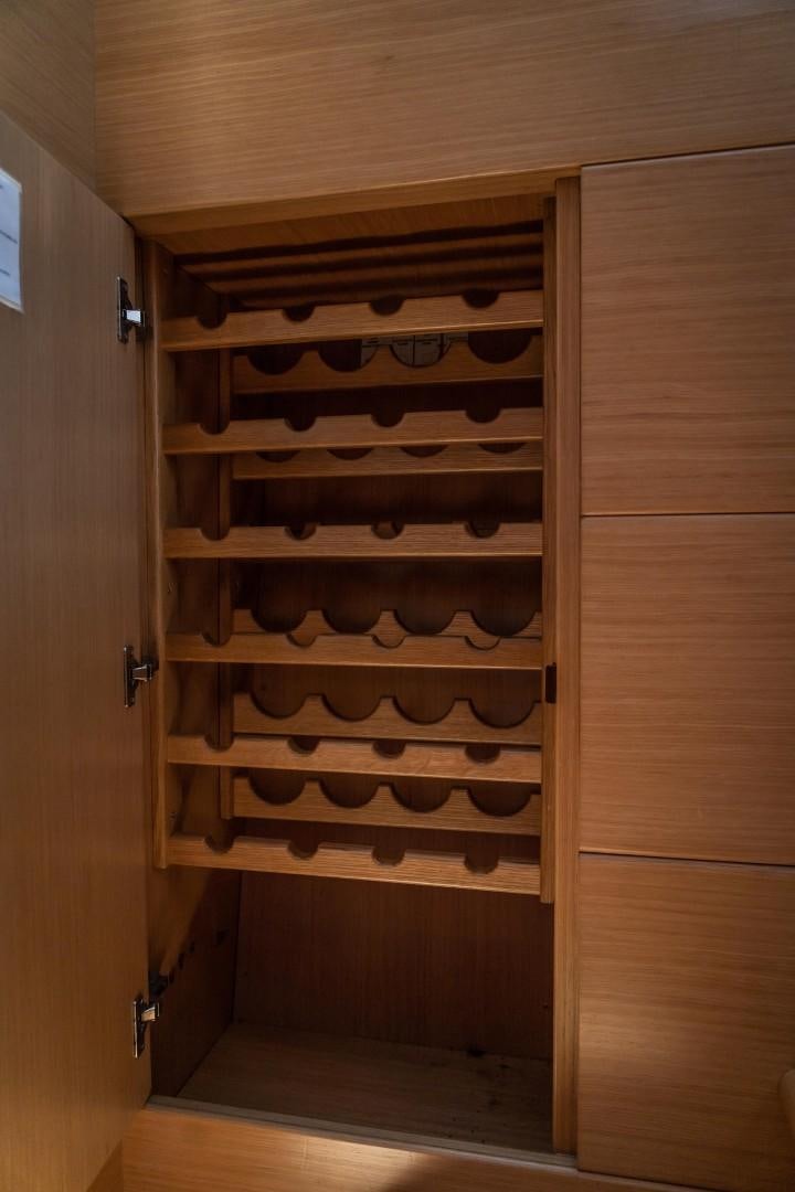 a wooden cabinet with black and white stripes aboard FORTIS II Yacht for Sale