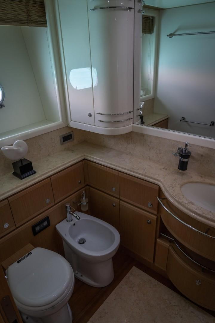 a bathroom with a sink and a toilet aboard FORTIS II Yacht for Sale