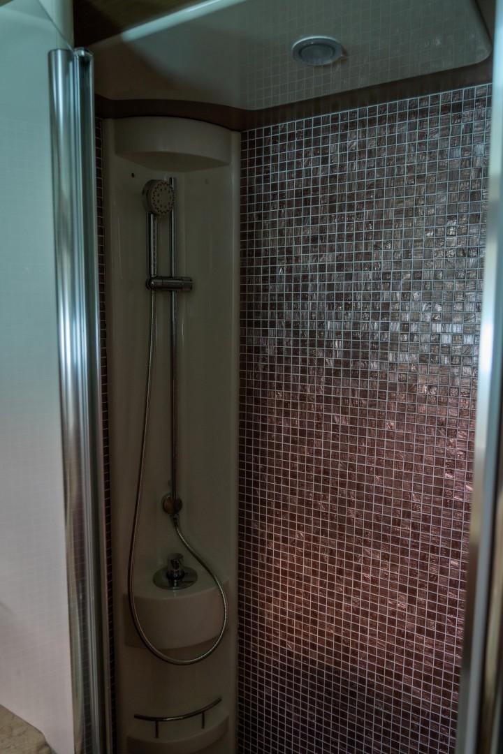 a bathroom with a shower aboard FORTIS II Yacht for Sale