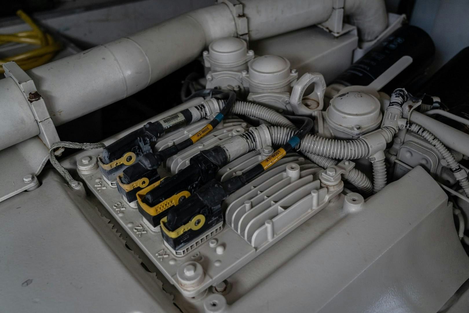 a close-up of a car engine aboard FORTIS II Yacht for Sale