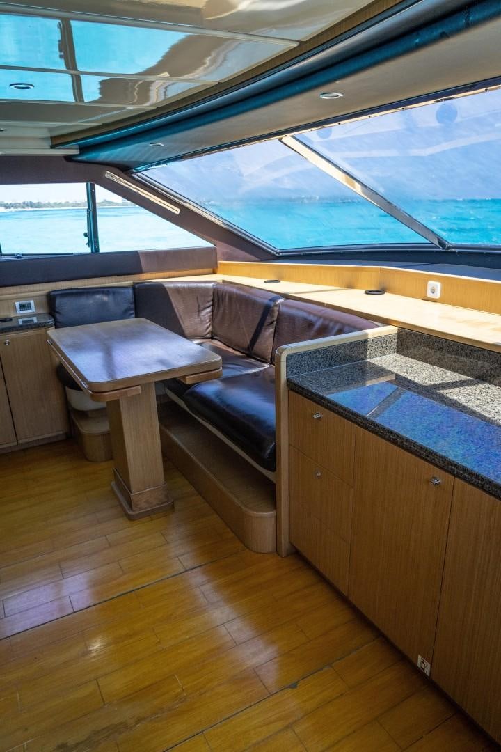 a room with a couch and a table aboard FORTIS II Yacht for Sale