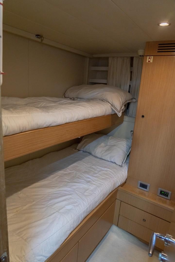 a room with two beds aboard FORTIS II Yacht for Sale