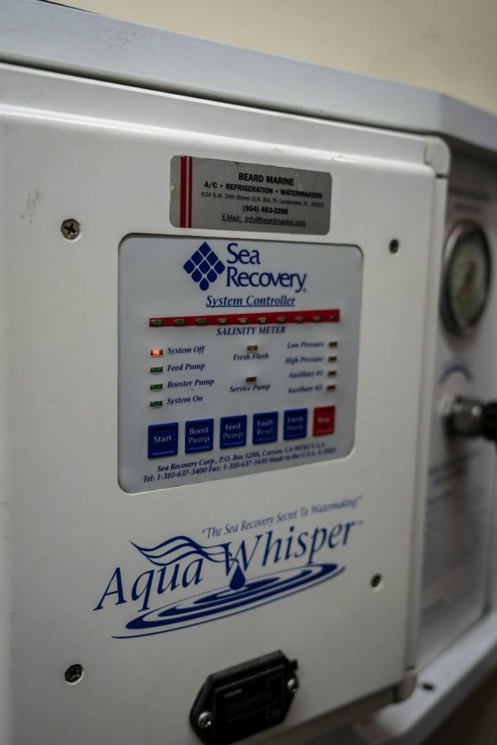 a close-up of a washing machine aboard FORTIS II Yacht for Sale