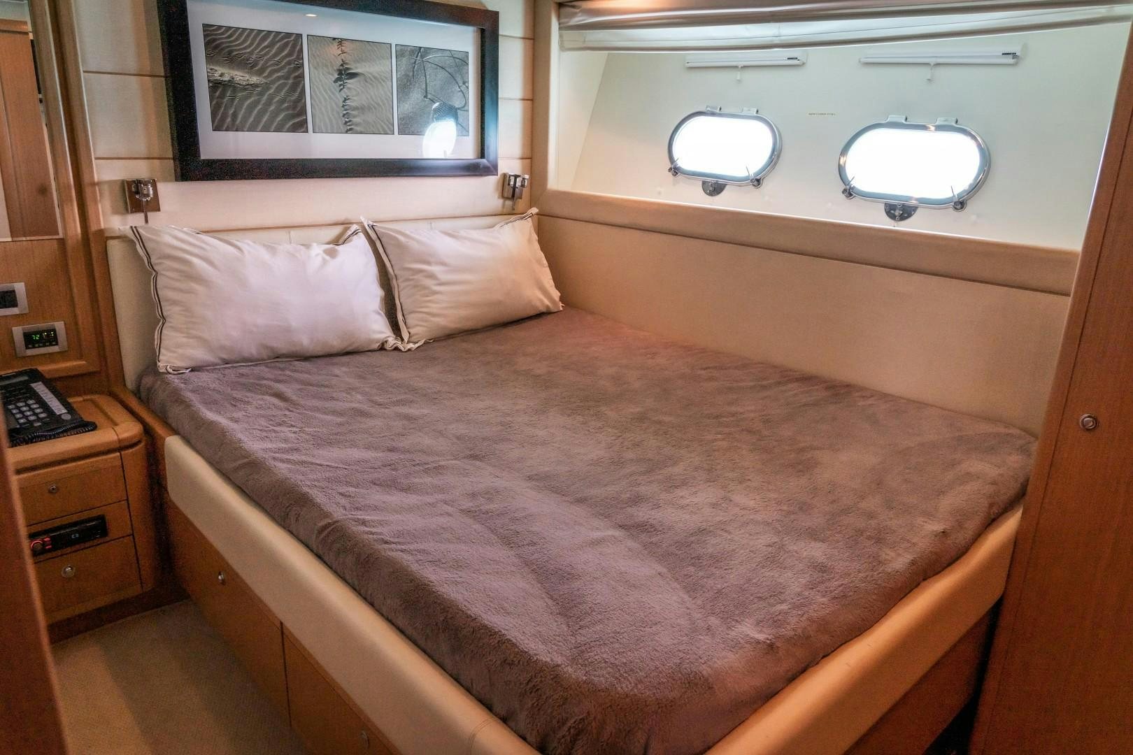 a bed with a pillow and a pillow on it aboard FORTIS II Yacht for Sale