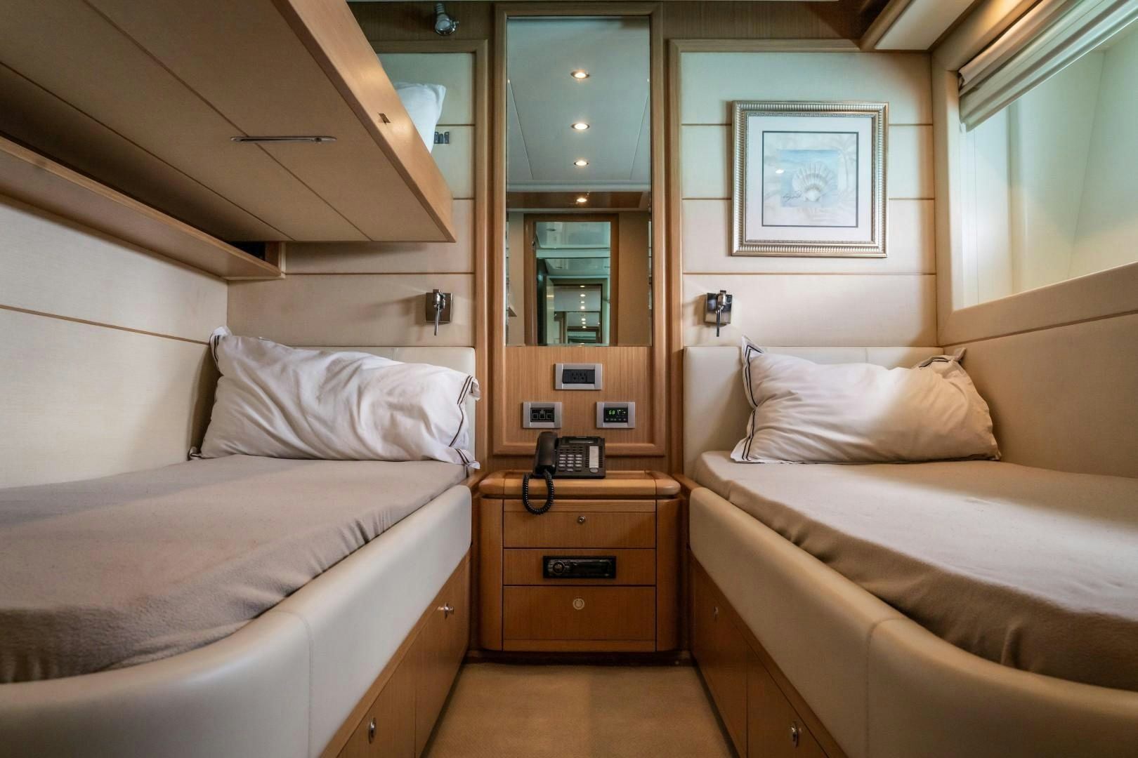 a room with two beds aboard FORTIS II Yacht for Sale