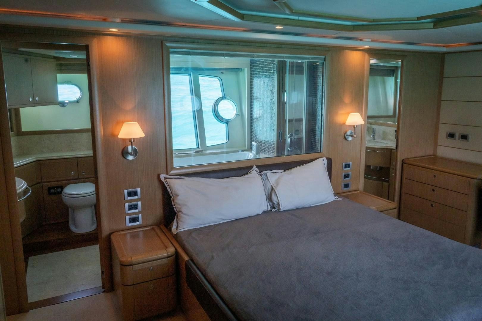 a large bedroom with a large bed aboard FORTIS II Yacht for Sale