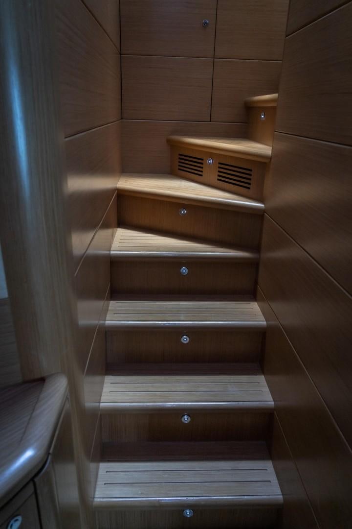 a wooden dresser in a room aboard FORTIS II Yacht for Sale