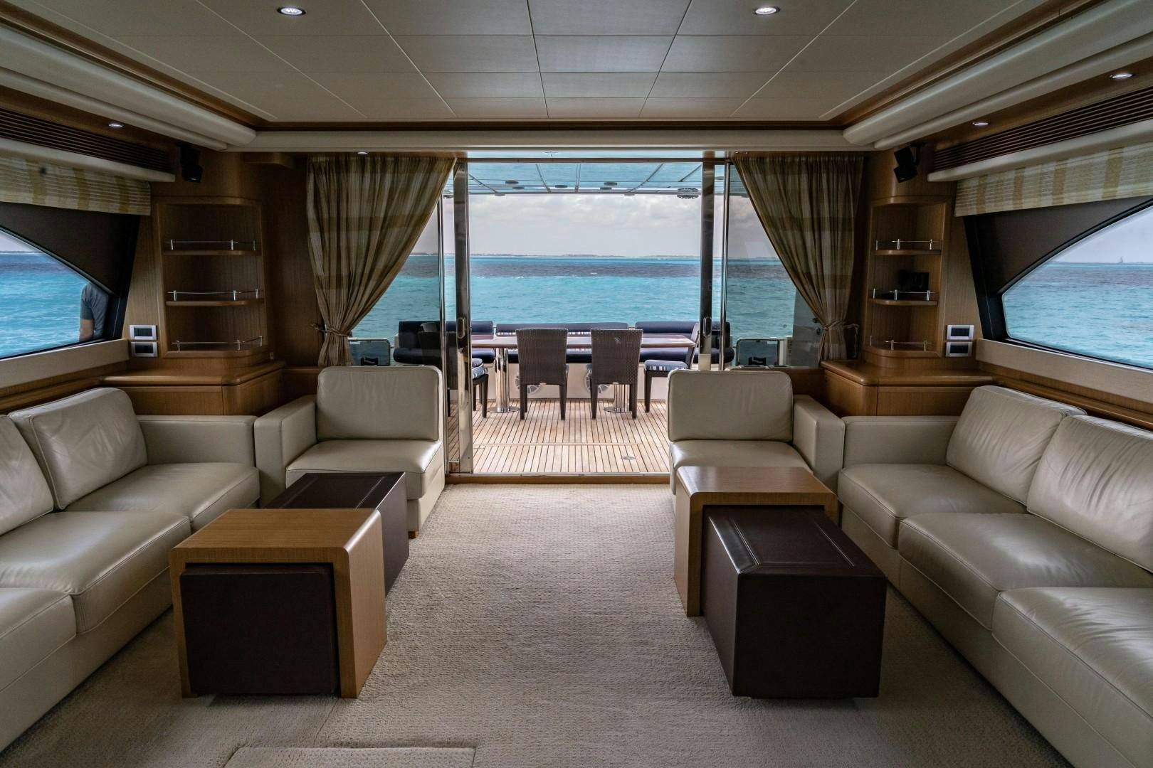 a living room with a large window aboard FORTIS II Yacht for Sale