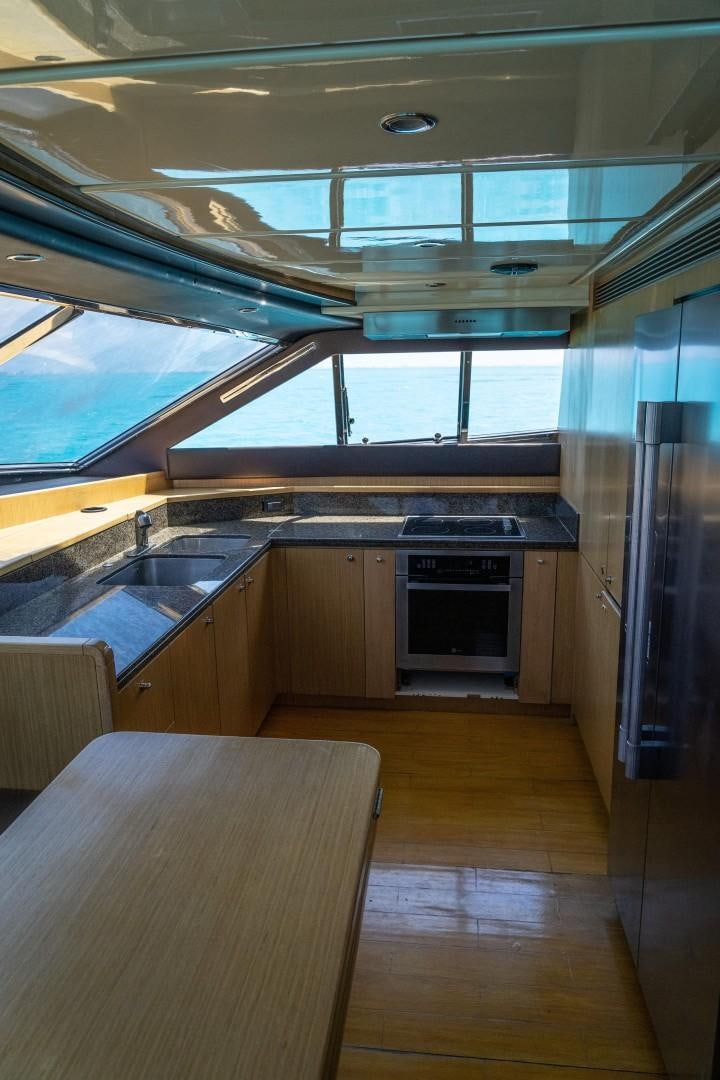 a kitchen with a large window aboard FORTIS II Yacht for Sale