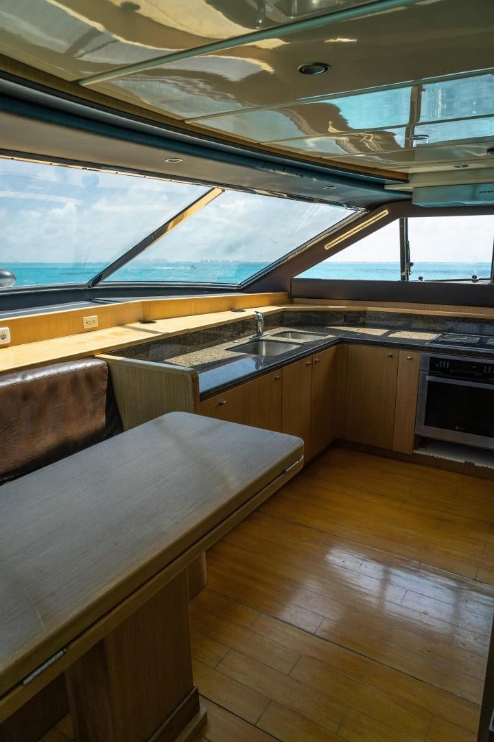 a kitchen with a large window aboard FORTIS II Yacht for Sale