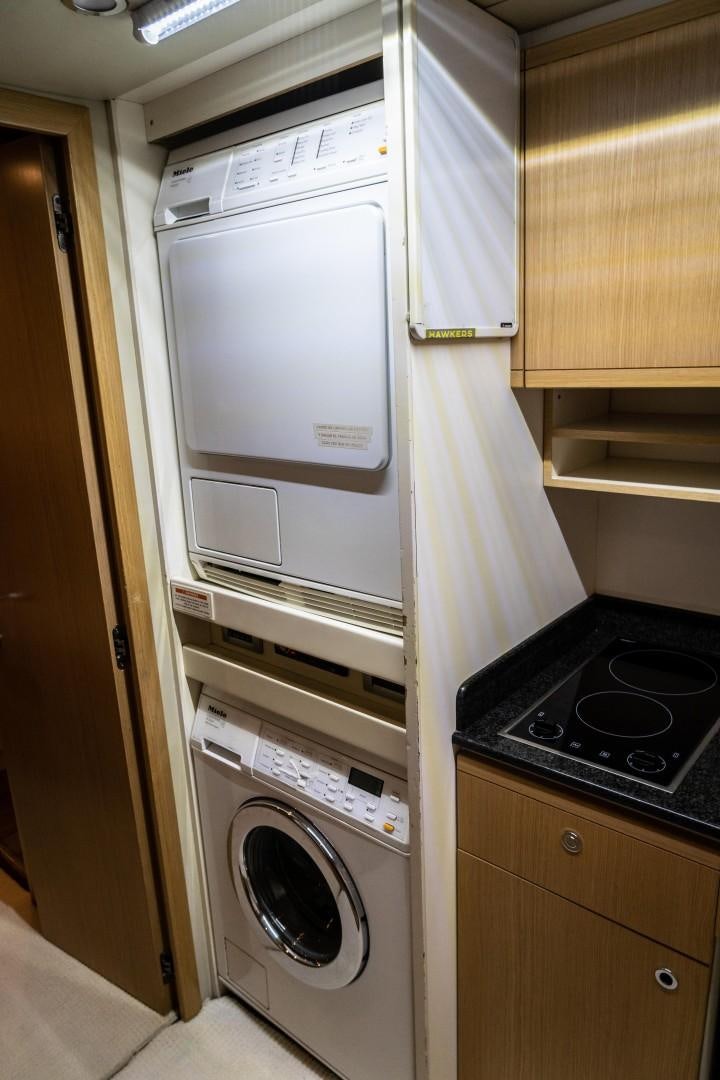 a white microwave oven in a kitchen aboard FORTIS II Yacht for Sale