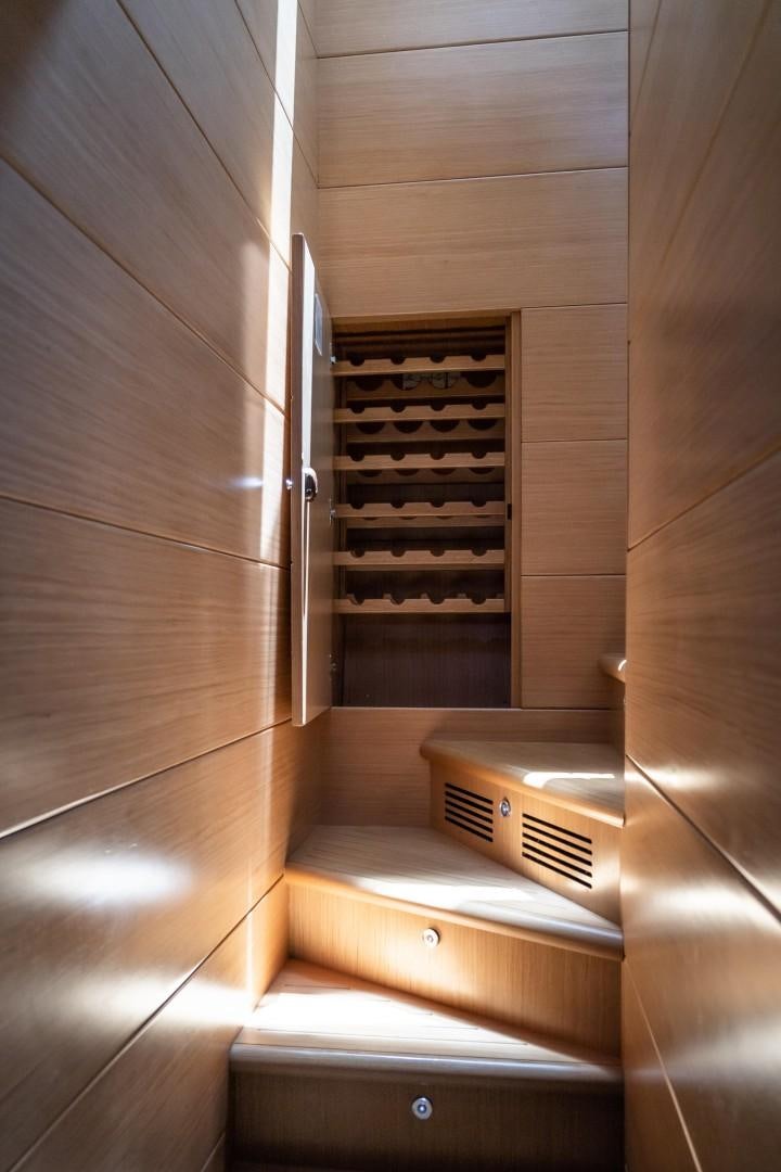 a wooden staircase with wooden walls aboard FORTIS II Yacht for Sale