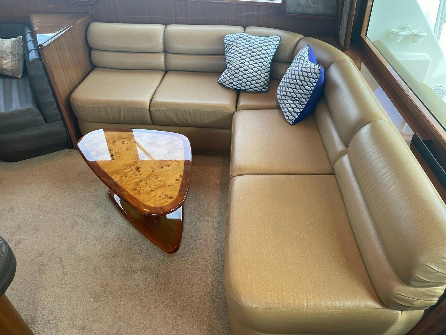 a room with a couch and a table aboard BANDIT Yacht for Sale