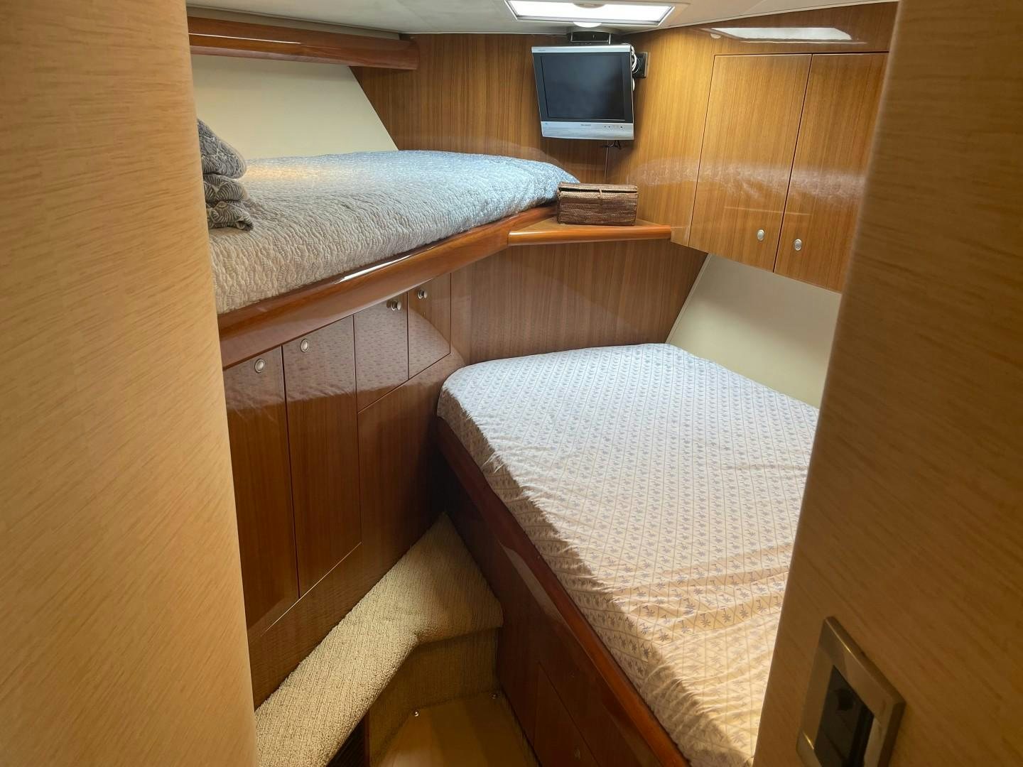 a couple of beds in a room aboard BANDIT Yacht for Sale