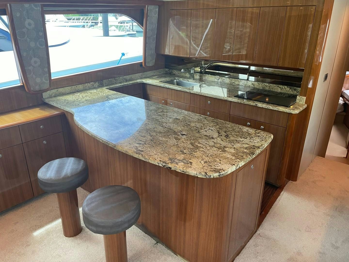 a kitchen with a large marble counter aboard BANDIT Yacht for Sale