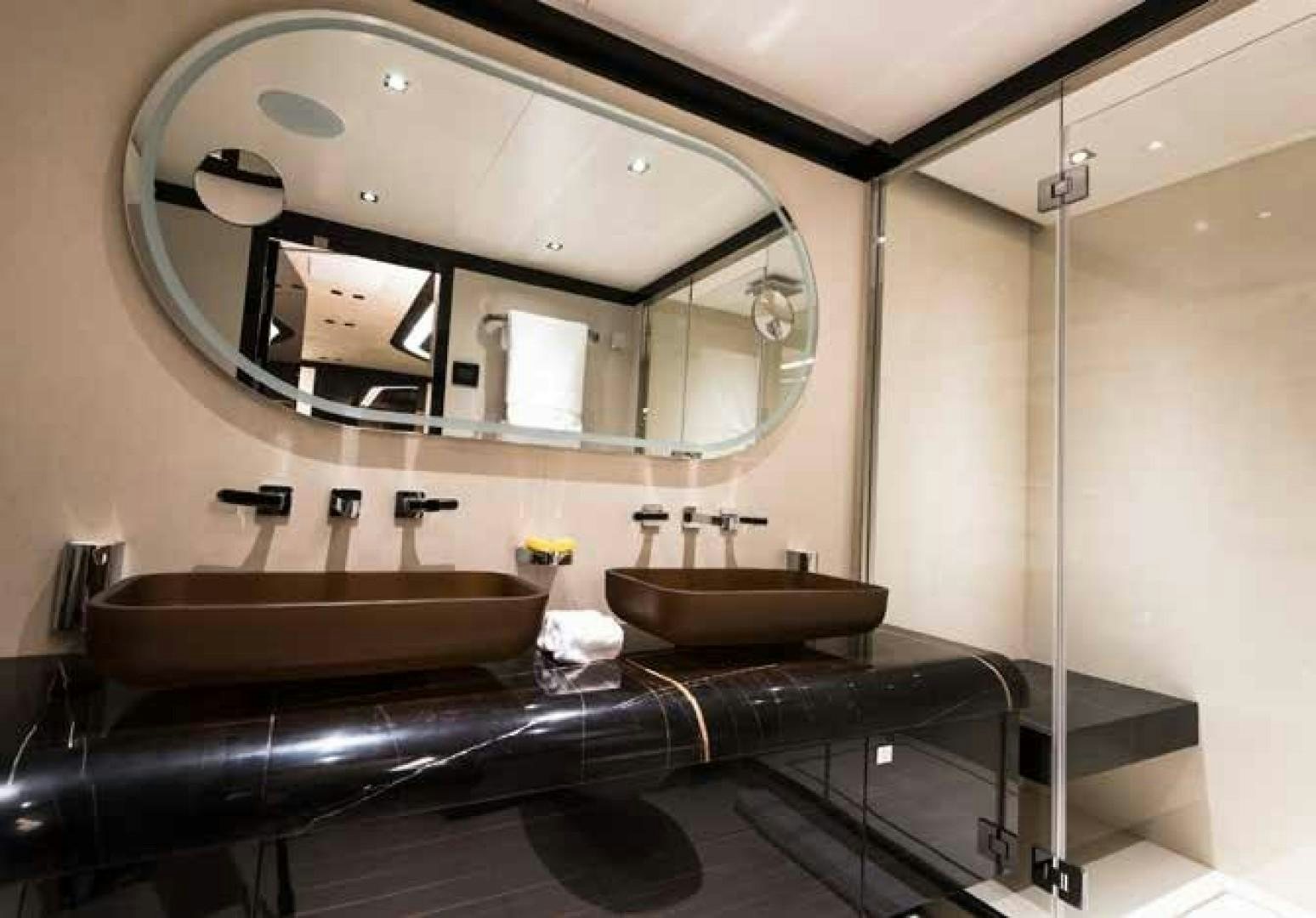 a bathroom with a large mirror aboard GTT 115 Yacht for Sale