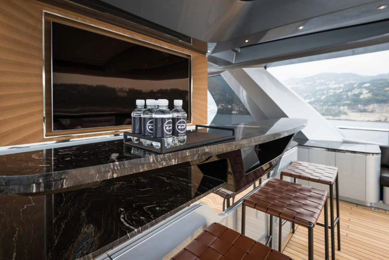 a coffee machine on a table aboard GTT 115 Yacht for Sale