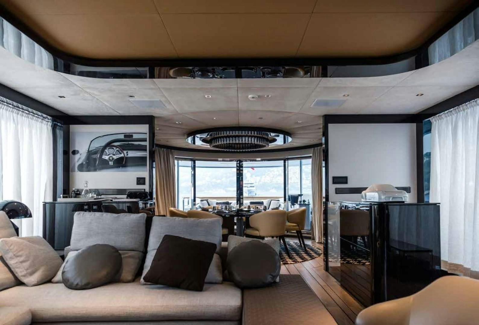 a living room with a large window aboard GTT 115 Yacht for Sale