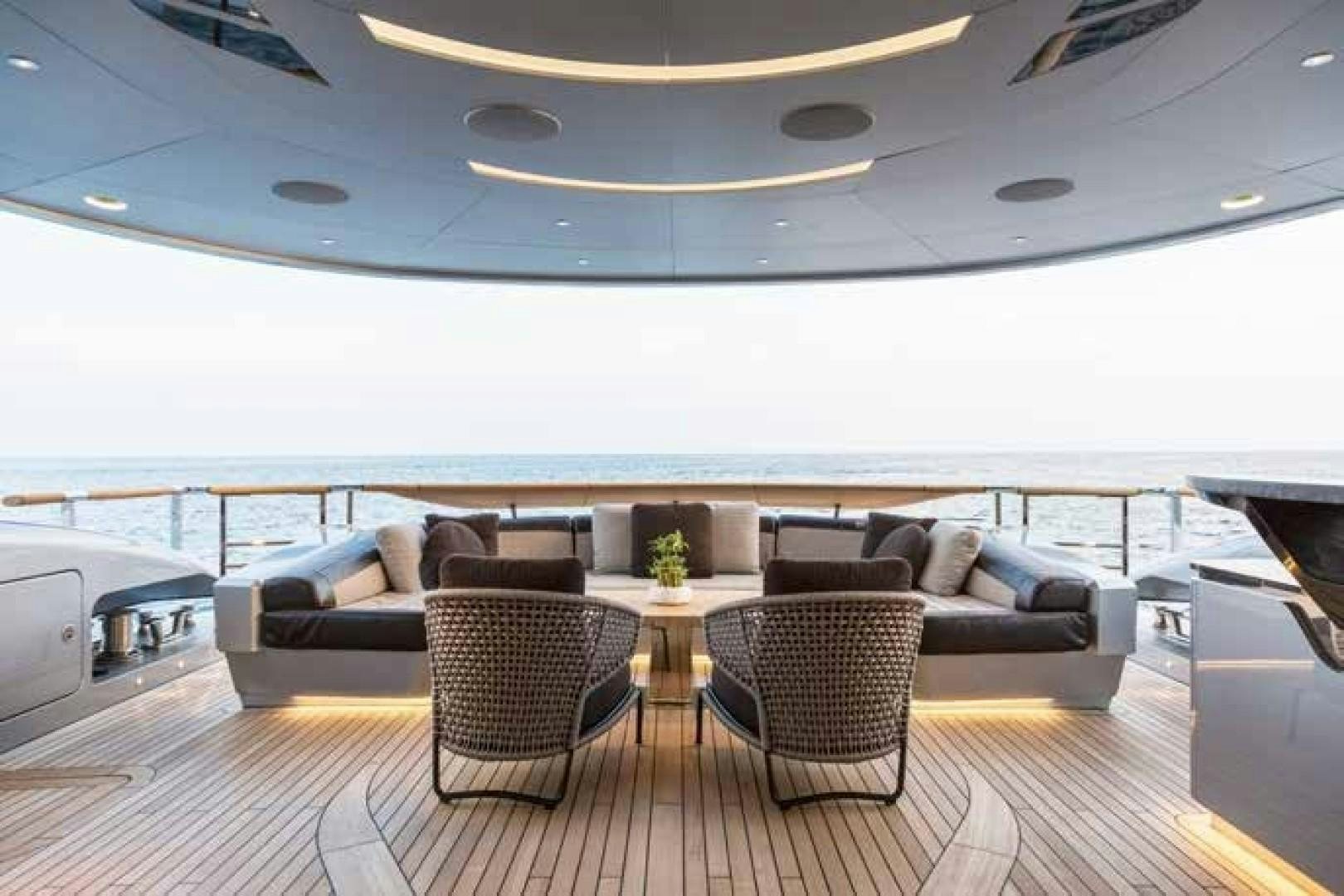 a living room with a large window aboard GTT 115 Yacht for Sale
