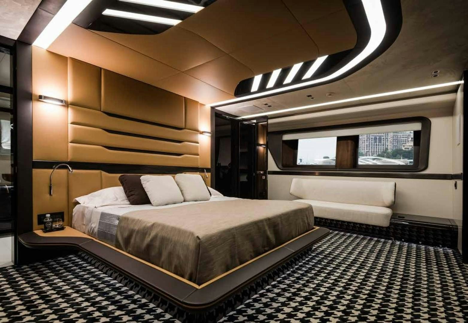 a room with a bed and a couch aboard GTT 115 Yacht for Sale