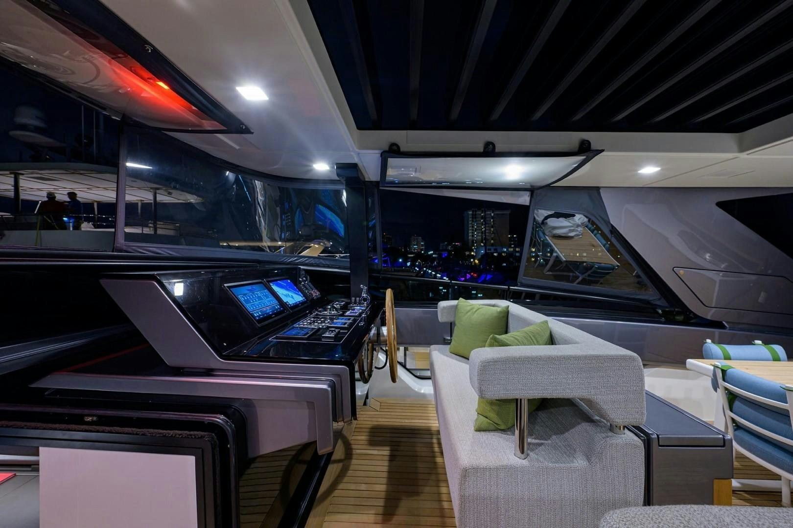 inside of a building with a large display of screens and chairs aboard NINIPOP XL Yacht for Sale