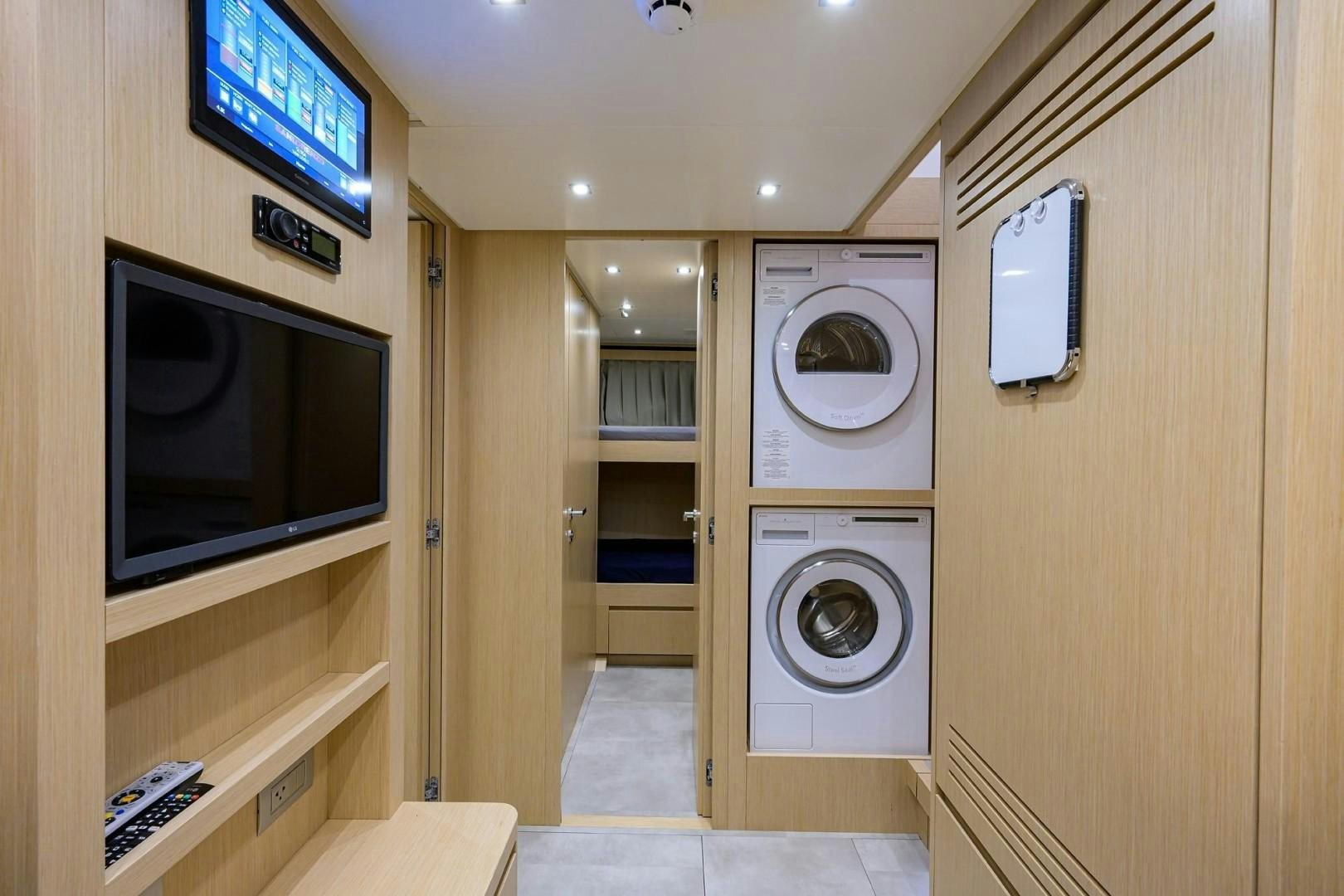 a room with a washer and dryer aboard NINIPOP XL Yacht for Sale