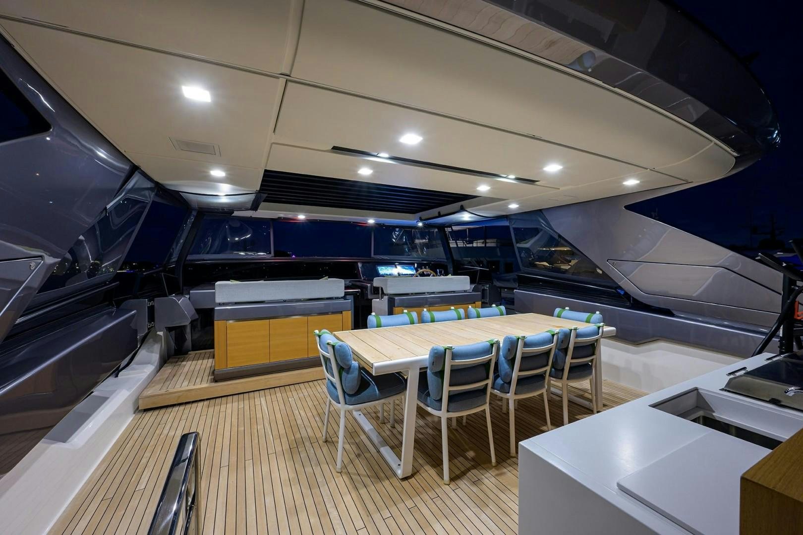 a room with tables and chairs aboard NINIPOP XL Yacht for Sale