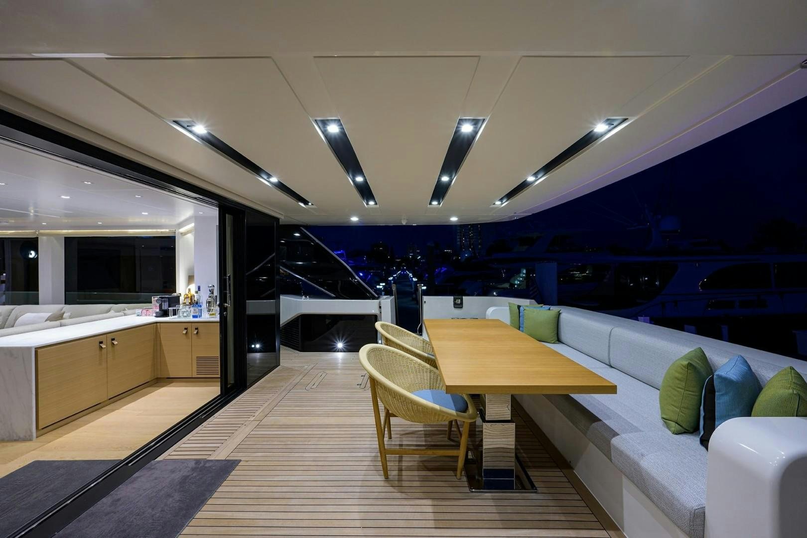 a room with a table and chairs aboard NINIPOP XL Yacht for Sale
