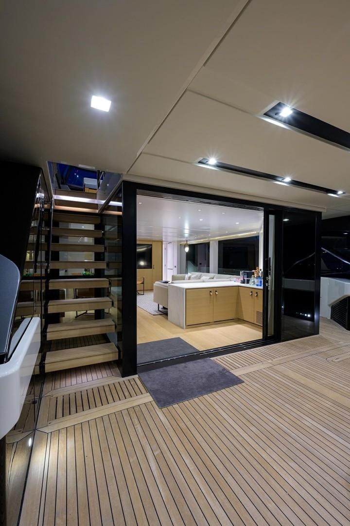 a room with a wood floor and a staircase aboard NINIPOP XL Yacht for Sale