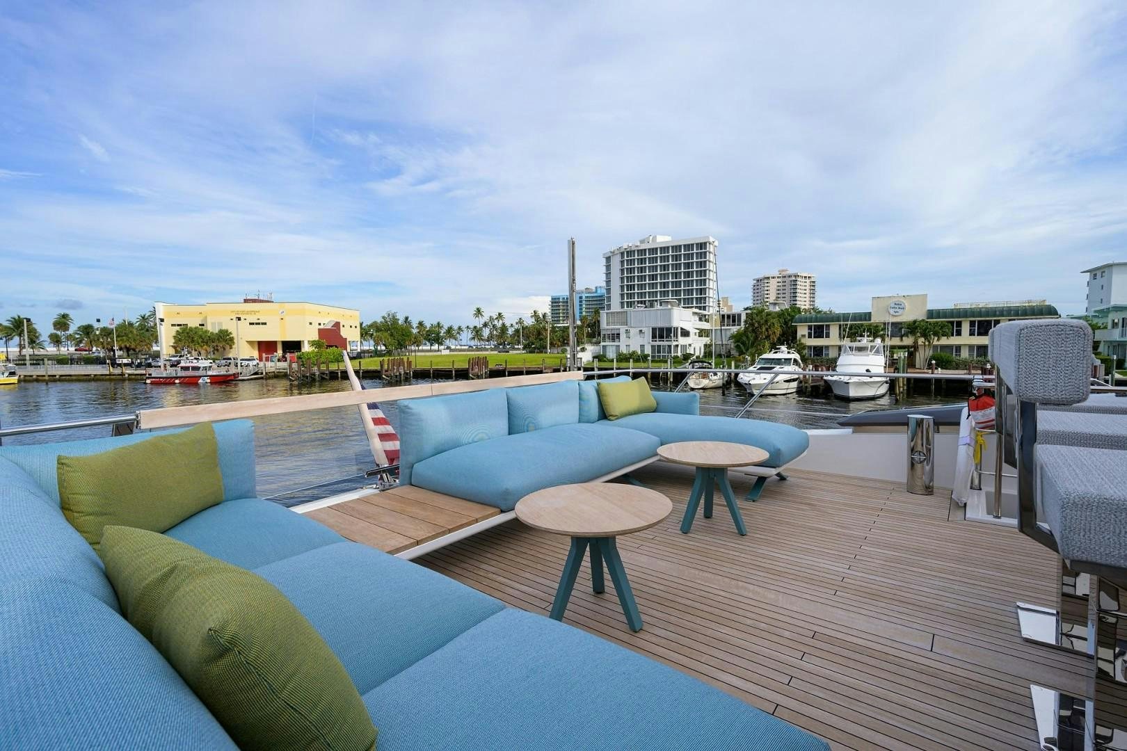 a deck with a pool and boats aboard NINIPOP XL Yacht for Sale