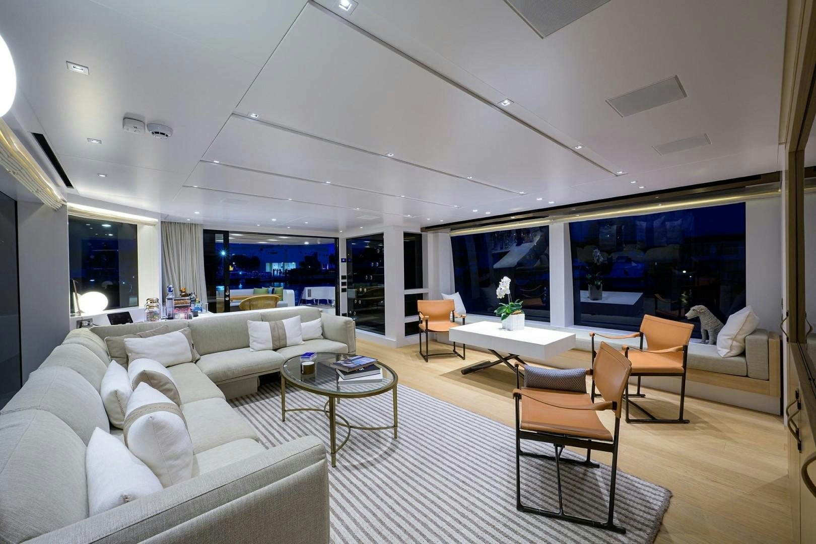 a living room with a large window aboard NINIPOP XL Yacht for Sale