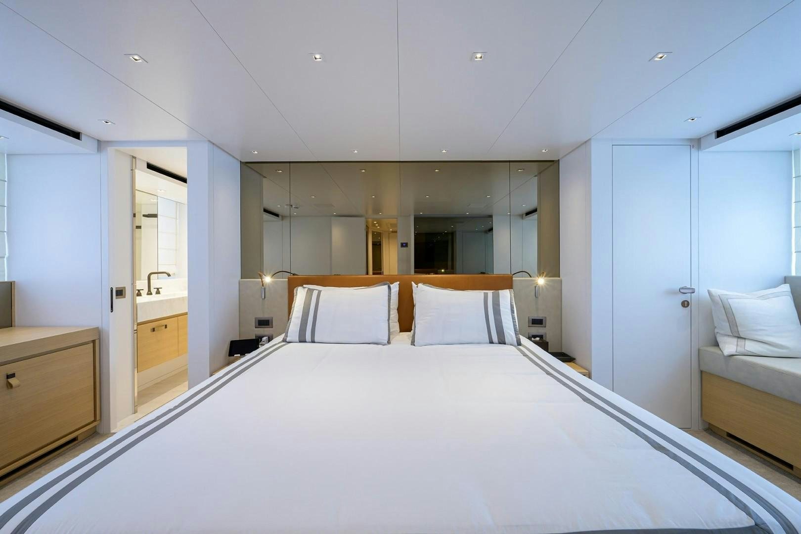 a large white bed in a room aboard NINIPOP XL Yacht for Sale