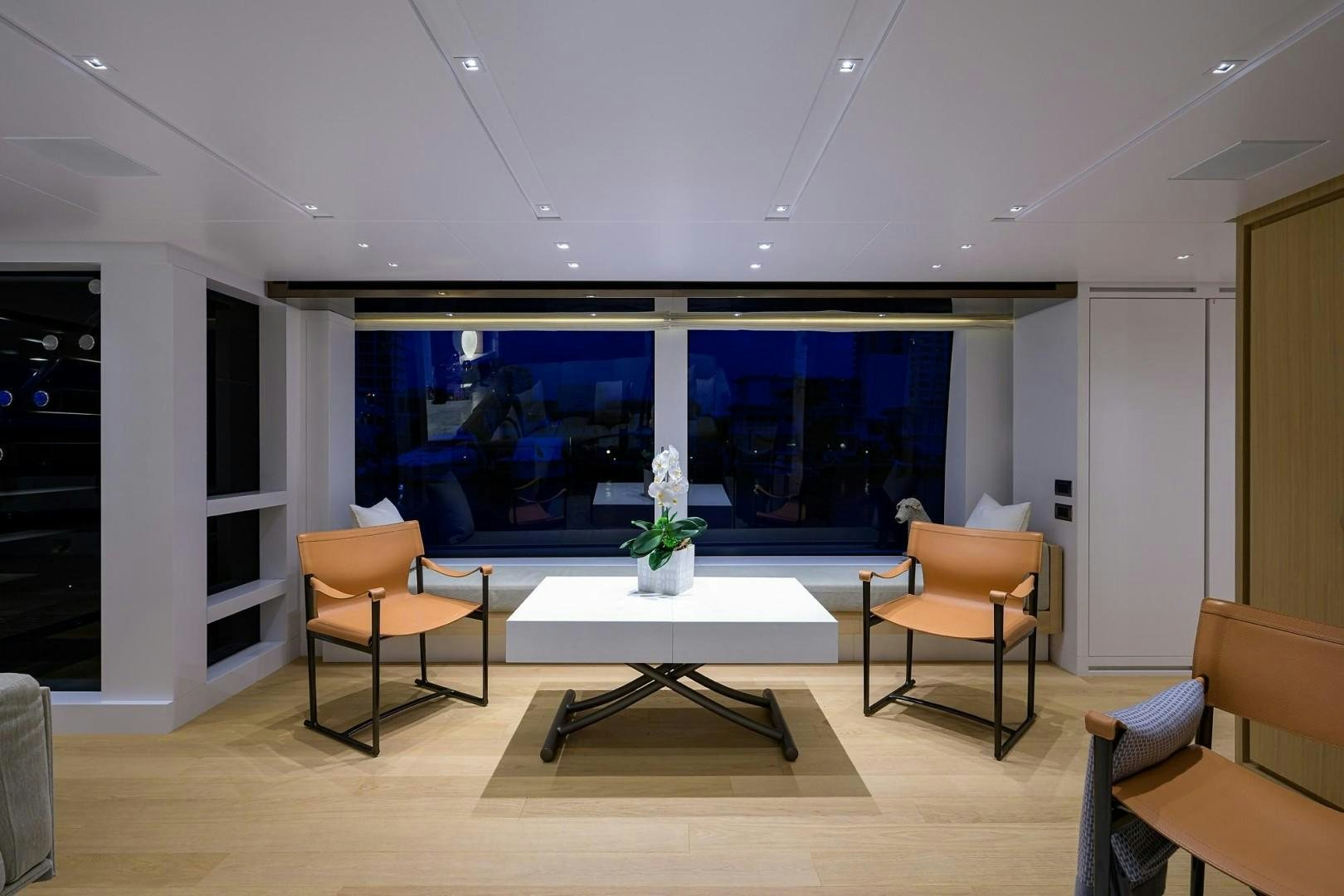 a room with a table and chairs aboard NINIPOP XL Yacht for Sale