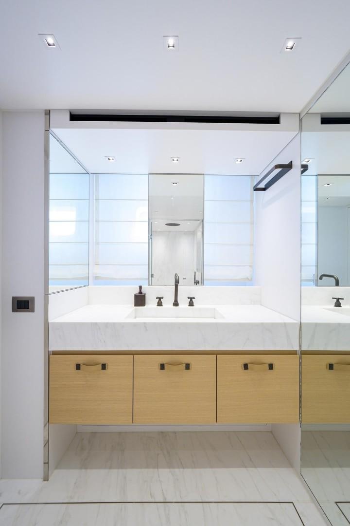 a bathroom with a large mirror aboard NINIPOP XL Yacht for Sale