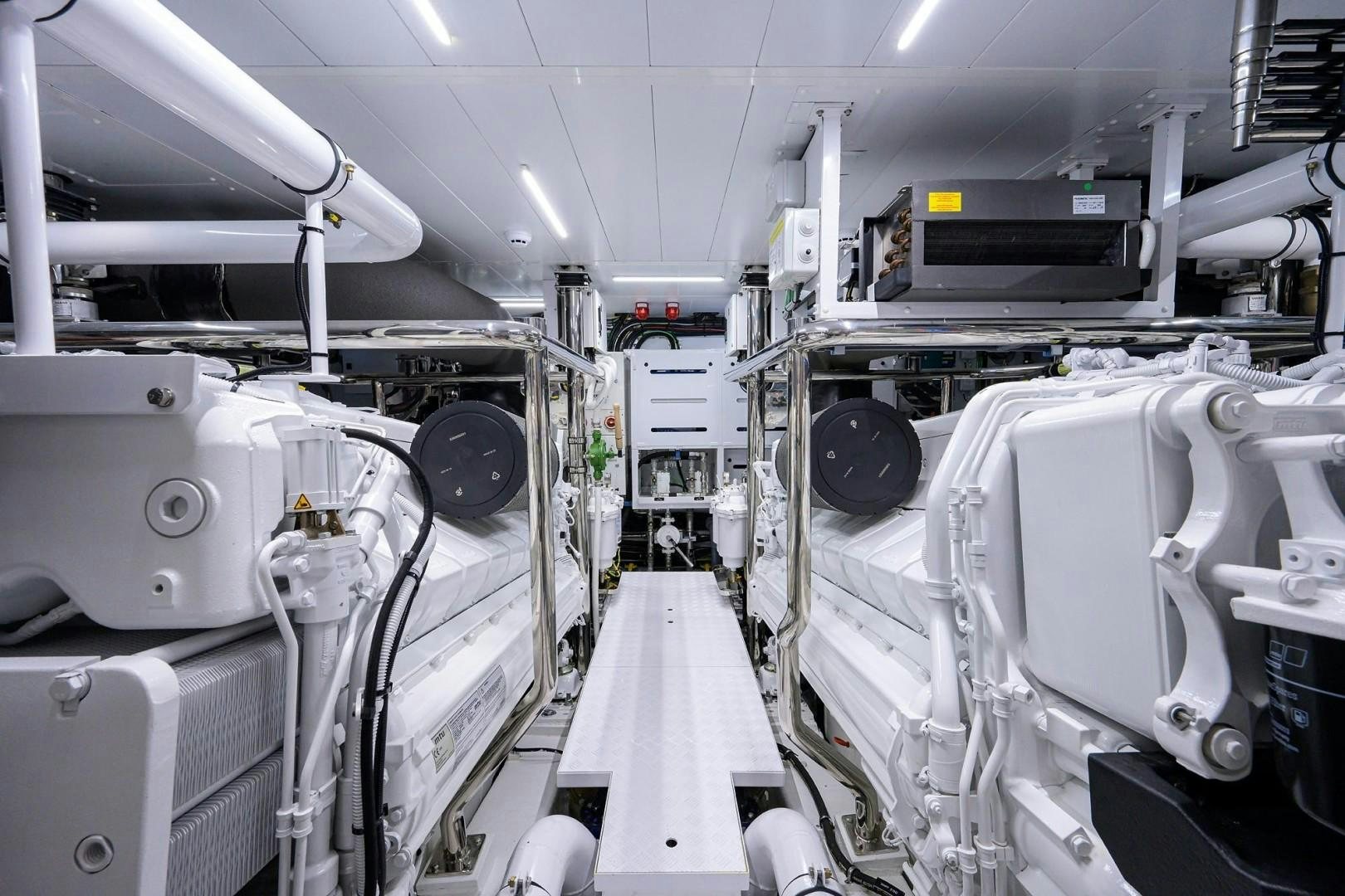 a room with several white machines aboard NINIPOP XL Yacht for Sale