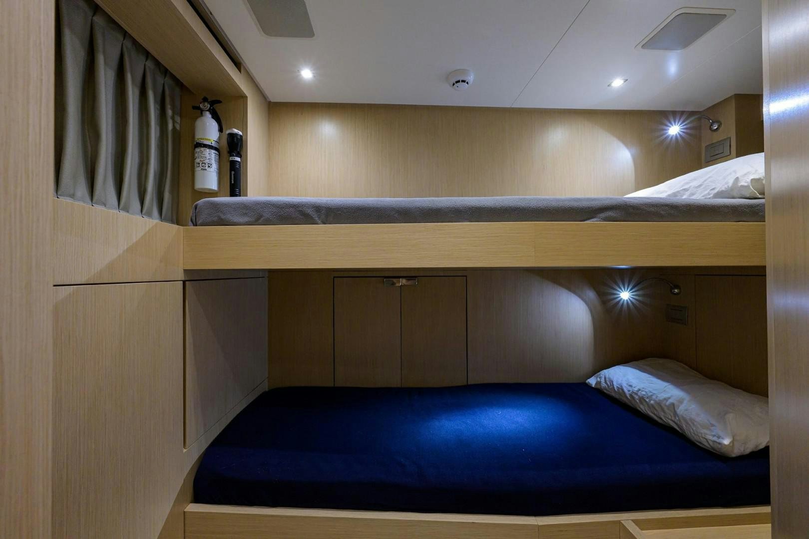 a room with a bed and a curtain aboard NINIPOP XL Yacht for Sale