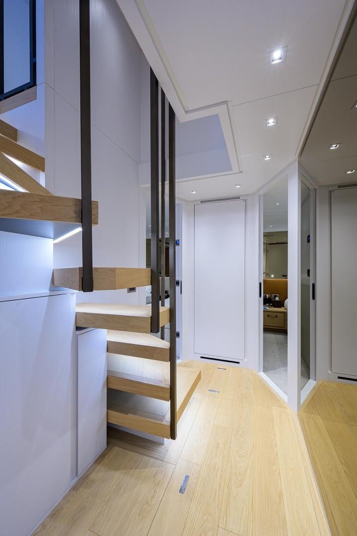 a room with a staircase and a wood floor aboard NINIPOP XL Yacht for Sale